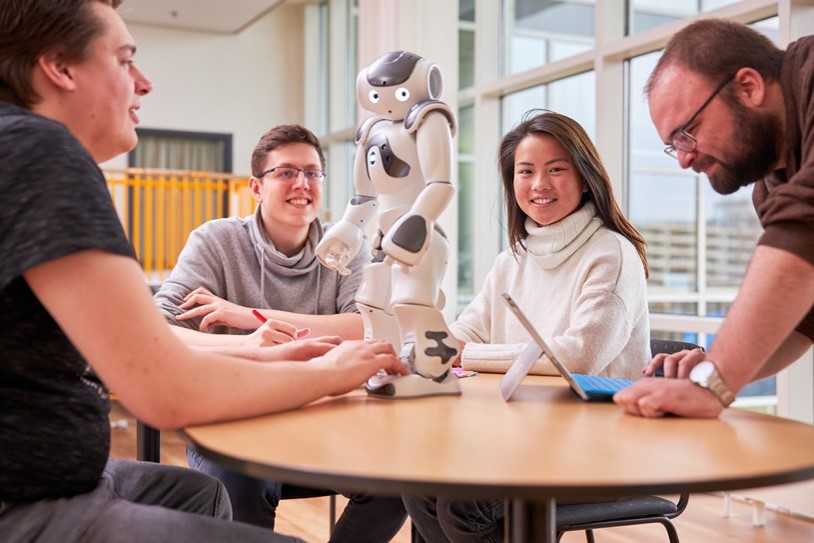 Students interacting with Social Roboti